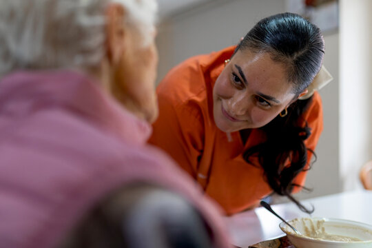 Elderly woman receiving compassionate care at residence