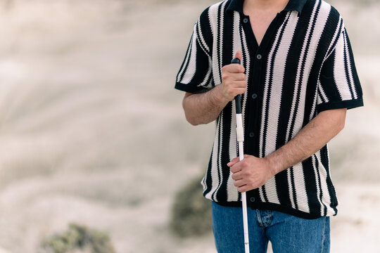Blind man with cane demonstrating resilience