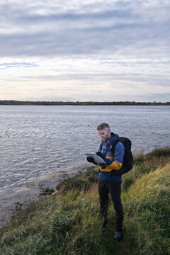 Environmental Scientist Monitoring Water Quality for Chemical Pollutants and Habitat Degradation during Fieldwork