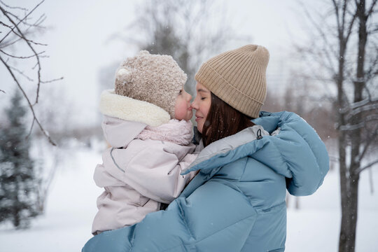 Mother and child enjoying a winter day in the park