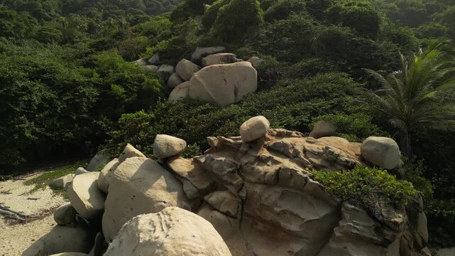 beach arrecifes, tayrona national park, tayrona park colombia, colombia beach, drone 4k, aerial footage, caribbean coast, wild beach, tropical nature, rocky beach, waves crashing, jungle hills, golden