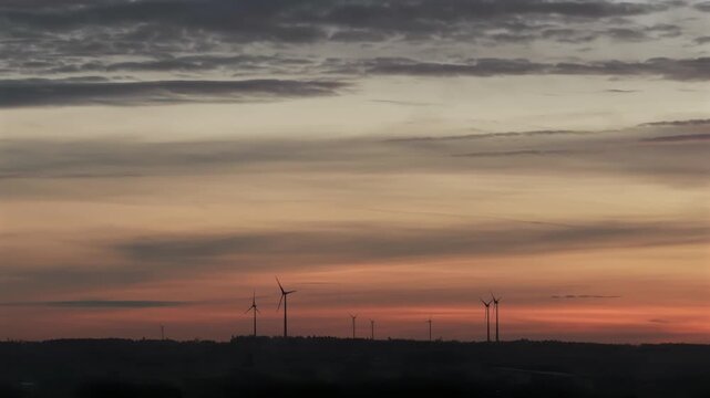 New Energy wind mill during sunset phase in Bavaria area