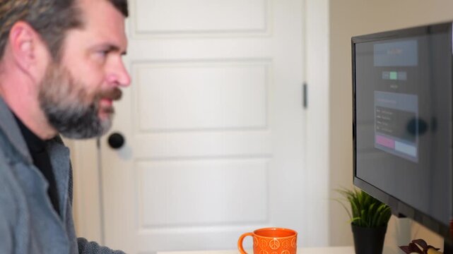 Middle Aged Man Gets Barrage of Internet of Things Smart Home Alerts While Working from Home in Remote Office - IoT Cybersecurity Concept