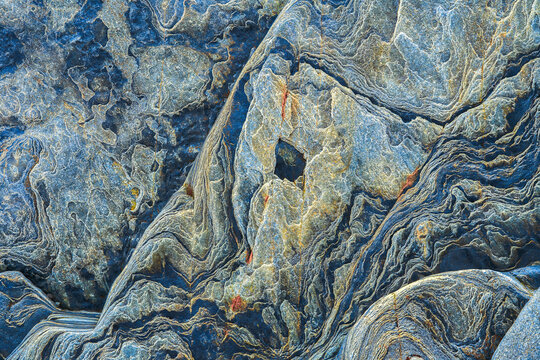 Cliff rock texture with natural geological patterns