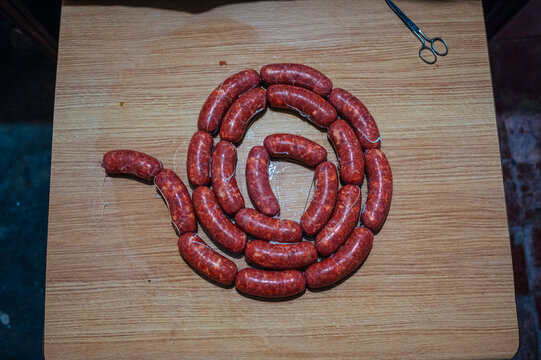 Traditional preparation of chorizo on a rustic wooden table