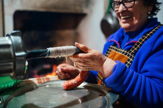 Traditional preparation of chorizo in a rustic kitchen