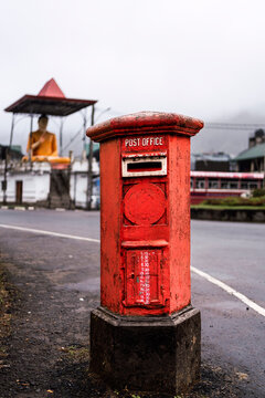 Vintage red postbox in Sri Lanka by a roadside