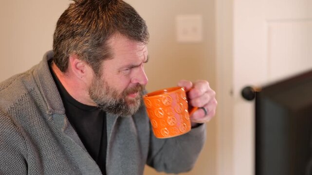 Middle Aged Man Gets Barrage of Internet of Things Smart Home Alerts While Working from Home in Remote Office - IoT Cybersecurity Concept