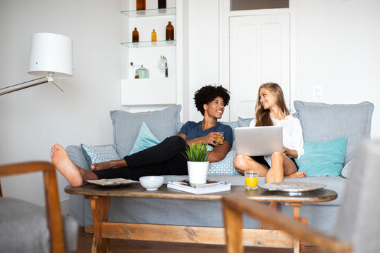 Relaxed multiethnic couple enjoying time together at home