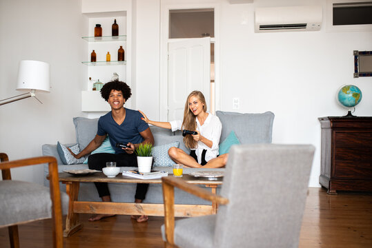 Multiethnic couple enjoying time at home