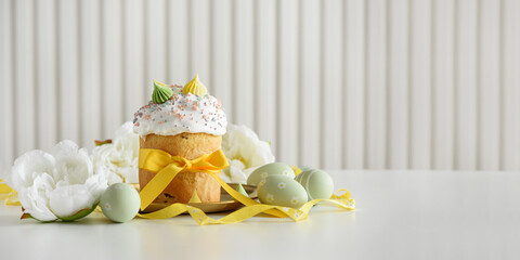 Easter Cake Decorated Yellow Ribbon with Flowers and Pastel Eggs on White Background