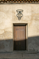 Small historic stone house facade with basketball hoop