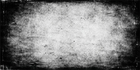 Fototapeta premium A dark and moody grunge film strip background featuring an aged concrete wall texture with dirty grey stone patterns and a vintage rough paper frame design on an antique black surface