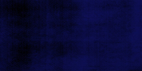 Fototapeta premium A dark blue grunge background featuring a rough denim fabric texture and closeup cotton material pattern for a moody fashion design backdrop