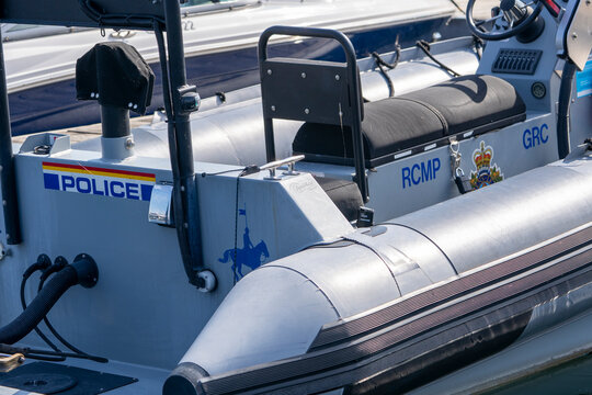 RCMP police patrol rigid hull inflatable boat detail tied to dock moorage 