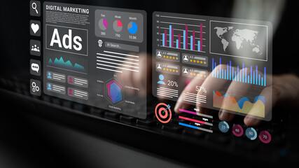 Modern digital marketing interface showcasing hands typing on a keyboard with vibrant analytics data, graphs, and insights for effective advertising performance. Gantry