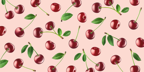 Fruit pattern of fresh ripe red cherries on light pink background