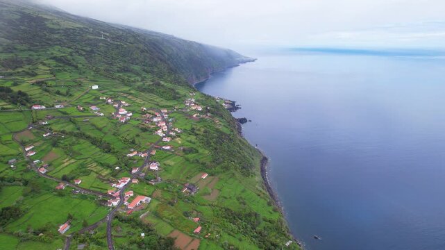AZORES - 11.3.2025 - Remarkable aerial footage circling a remote coastal village on the Azores' Sao Jorge Island.