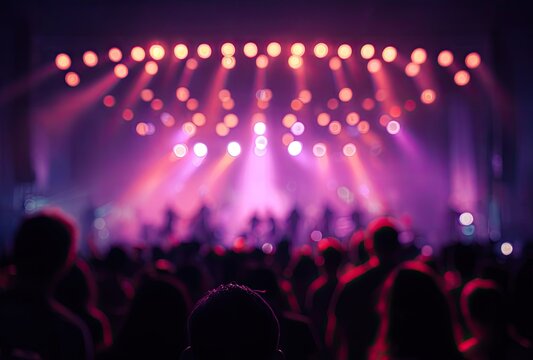 Blurred crowd under stage lighting at event concert entertainment