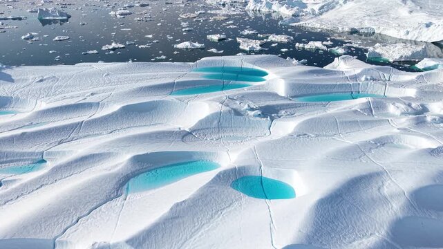 GREENLAND - 11.4.2025 - Good aerial footage moving over an ice fjord in Greenland.