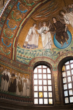 Apse mosaic in the Basilica di San Vitale in Ravenna, Italy. Historic 6th-century Byzantine art featuring Christ enthroned between two angels