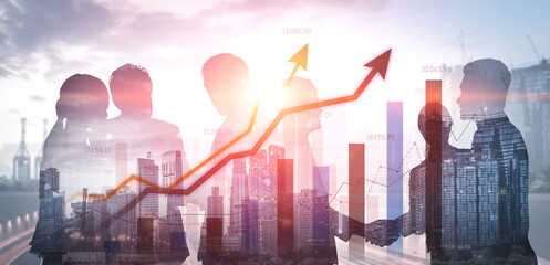 This image captures a business team in silhouette against a modern city skyline, showcasing financial growth with upward trending graphs and urban development. Scalp