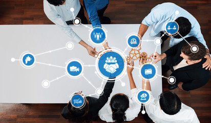 Professionals collaborate in a modern office setting, integrating technology and innovative strategies to enhance business partnerships and drive growth through teamwork. Amity