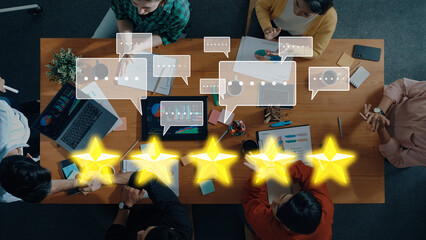 A dynamic business team engages in a collaborative meeting, discussing feedback and ratings in a modern workspace, showcasing technology and teamwork efforts. Trope