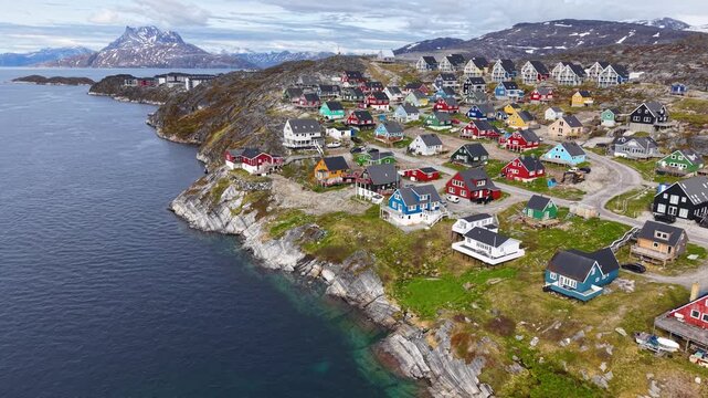 GREENLAND - 11.4.2025 - Gorgeous aerial view of Nuuk, Greenland's coastline filled with colorful houses.