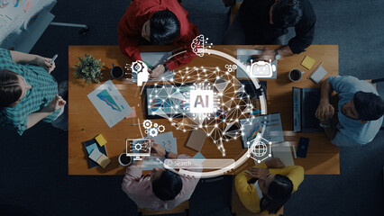 Aerial view of a collaborative meeting where a diverse group brainstorms ideas using AI technology in a modern office space, showcasing teamwork and innovation. Trope