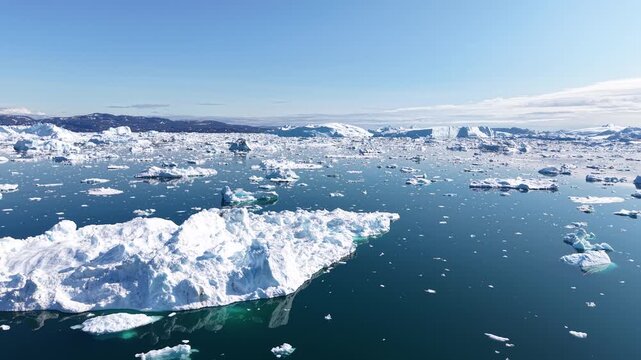 GREENLAND - 11.4.2025 - Very good aerial footage crossing an ice fjord on Greenland's Disko Bay.