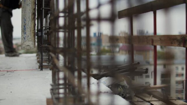 Lowering formwork onto reinforcement cage at construction site