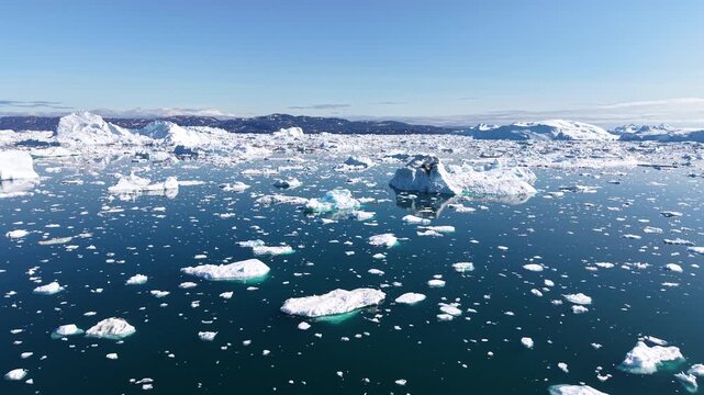 GREENLAND - 11.4.2025 - Good aerial footage passing over ice floes of varying sizes on Greenland's Disko Bay.