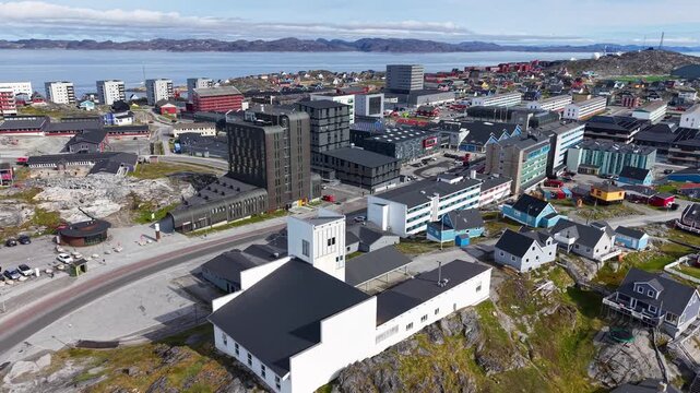 GREENLAND - 11.4.2025 - Wonderful aerial footage moving over the coastal city of Nuuk, Greenland bound for the water.