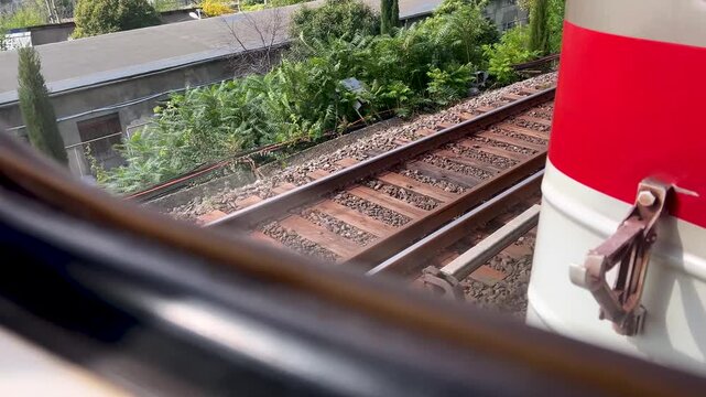 Horizontal 4K defocused video. View from window of railway passenger train carriage. Metro train rides on rails. Concept of arrival, speed, public transport, travel, tourism, rest, calm, road trip