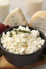 Different dairy products and thyme on table, closeup