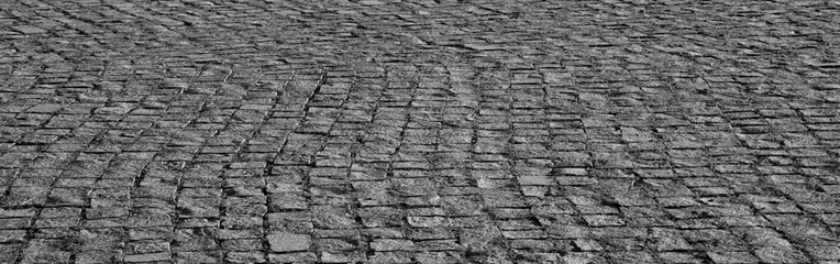 Old cobblestone pavement Overhead perspective of stone pavement serving layout background textured surface for visual projects new modern square cobble stone paving perspective backdrop Green grass