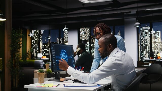 Black IT consultants workers use AI big data and predictive analytics, smart work solutions and cloud computing for adaptive strategies. Artificial intelligence engineering algorithms.
