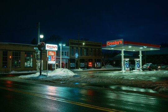 Crosbys gas station with snow in the winter at night, Springville, New York