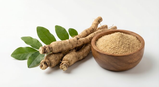 Tongkat ali root and powder in wooden bowl with green leaves over white background.