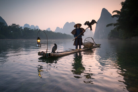 Fisherman with cormorants on the Li river, near Guilin, China