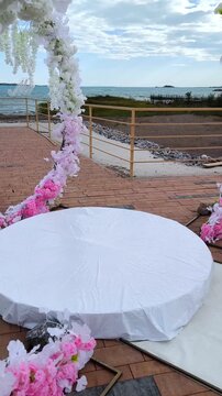 A wedding flower arch on the shore of Lake Balkhash overlooking the monument