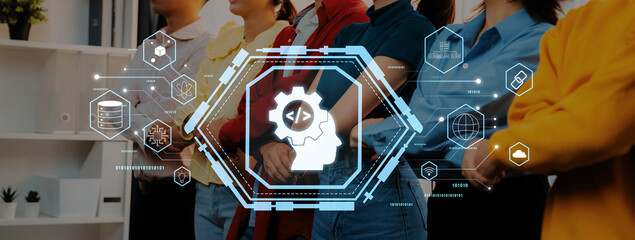 A diverse group of professionals stands together in a modern office environment, emphasizing the importance of teamwork and innovation through digital technology icons and concepts. Trope