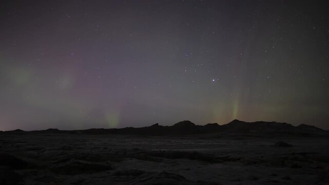 Satellites crossing the night sky aurora borealis and stars Iceland