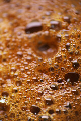 Extreme close up of espresso coffee bubbles as background