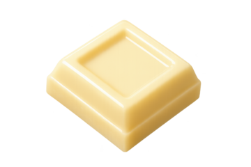 A single glossy white chocolate square piece, cream-colored and molded with a recessed top, photographed isolated on a transparent background