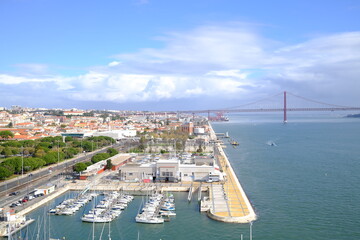 Obraz premium Lisbon waterfront with bridge and harbor