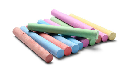 Many colorful chalks on white background