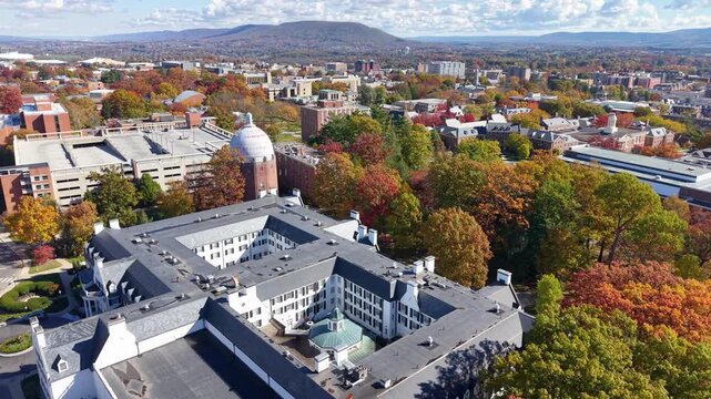 PENNSYLVANIA - 11.10.2025 - Gorgeous aerial footage circling Penn State University in autumn.