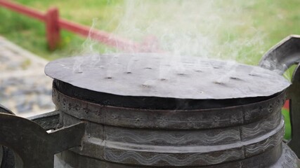 Smoking Buddhist Incense Burner Outside Mongolian Monastery During Circumambulation Ritual